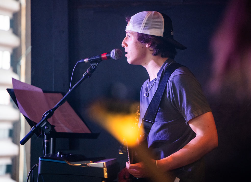 young male singer at mic